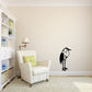 Standing egret wall decal with black silhouette.