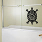 Ornate black turtle wall decal with decorative swirling lines