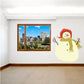 Snowman wall decal with smiling face, red hat, and green striped scarf