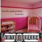 Wall decal with cursive quote text, black lettering on light wall