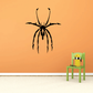Grass spider wall decal with black arachnid silhouette and legs, flat design