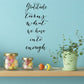Wall decal with cursive text: 'Gratitude turns what we have into enough'.