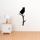 Black great horned owl silhouette decal on a branch