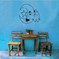 Gremlin moon wall decal with outlined crescent moon and mischievous face in dark ink