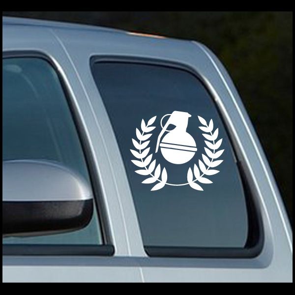 Grenade crest decal in white, grenade icon with laurel wreath on dark window