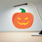Orange jack-o-lantern sticker with green stem and grinning face
