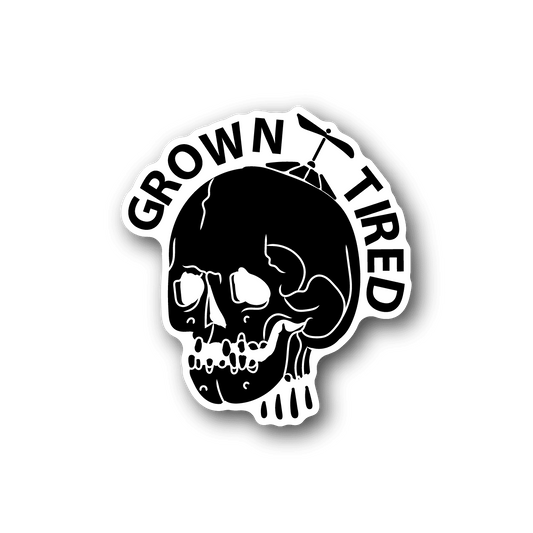 Vinyl sticker with white skull and circular 'Grown Tired' lettering