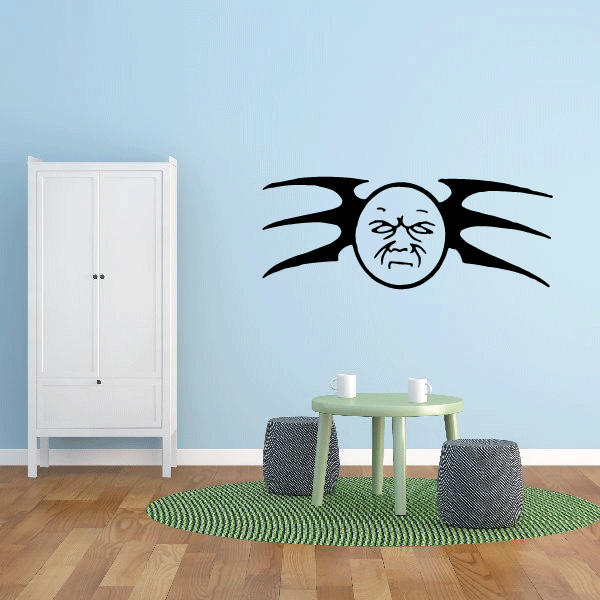 Tribal moon wall decal with grumpy face and spiky tribal rays