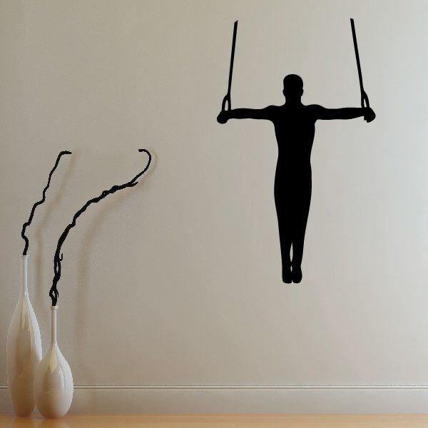 Gymnastics wall decal of black silhouette on swing rings