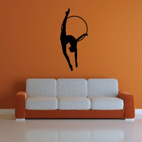 Gymnastics wall decal: black gymnast holding ball hoop pose on wall