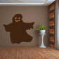 Halloween ghost sticker, dark brown with orange glowing eyes and mouth