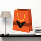 Halloween candy bag with orange color and black bat decor sticker
