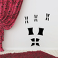 Haunted house window vinyl wall decals with black shutters on white wall