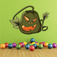 Halloween pumpkin decal with crazy vines, smiling green face, orange eyes and jagged grin