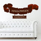 Tattered Halloween banner sticker with 'HALLOWEEN' and 'ELEMENTS' text, dark brown