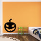 Toothy jack-o'-lantern pumpkin wall decal with black carved face