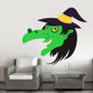 Halloween witch face sticker with big nose, green skin, black hat and yellow brim