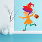 Witch trick-or-treat sticker: cartoon witch in red hat holding candy bag