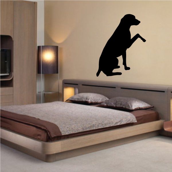 Black dog silhouette wall decal with raised paw handshake pose