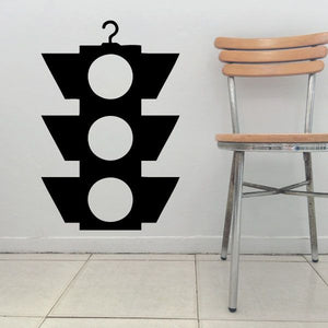 Hanging stop light decal with black chevron shape and three white circles