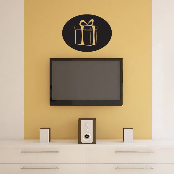 Oval decal with gold gift icon on dark background