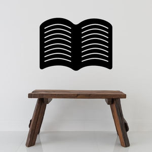 Open book decal with stacked text lines, black