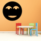 Smiling moon face wall decal with black circle and tan eyes and mouth