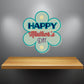 Happy Mother’s Day flower-shaped sticker with blue and teal lettering and floral accents