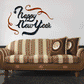 Happy New Year die-cut decal with black script and copper ornamental swirls