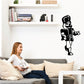 Black nutcracker vinyl wall decal of a soldier holding a staff, cartoon style.