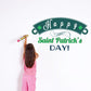 Decorative die-cut decal with Happy Saint Patrick's Day lettering and green shamrocks