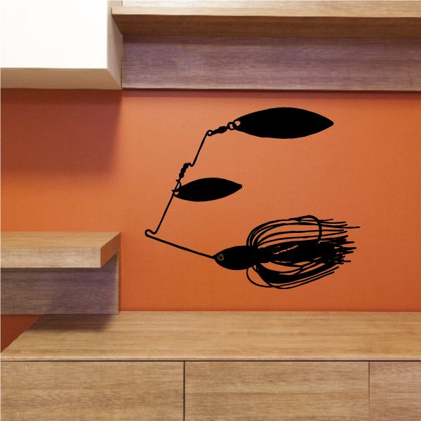 Black spinner lure decal with two blades and ribbed skirt