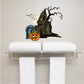 Haunted house wall decal with tombstone, bats, and glowing jack-o-lantern
