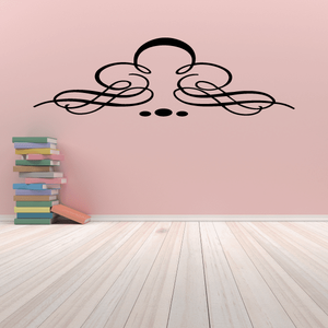 Vinyl wall decal with black ornamental scroll design and central face outline