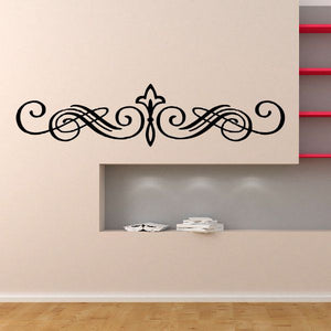 Black ornamental vinyl headboard decal with scrolls and centered fleur-de-lis