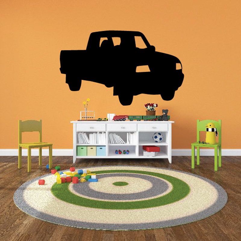 Vinyl wall decal of a dark pickup truck with illuminated headlights and grille.