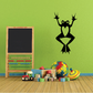 Heart frog wall decal: black frog holding green heart, arms raised.
