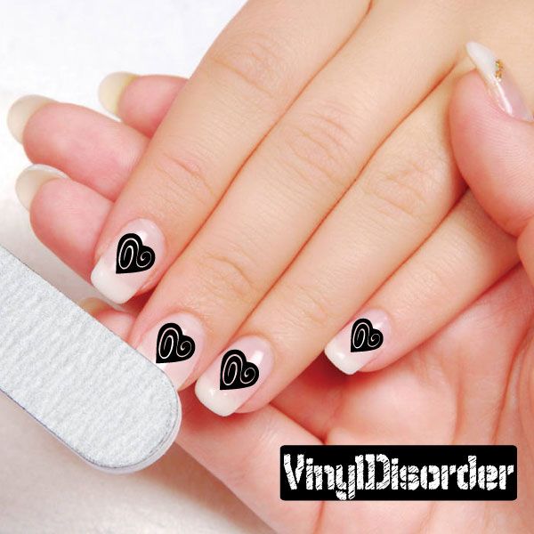 Fingernail art sticker set with black swirl hearts on white nails