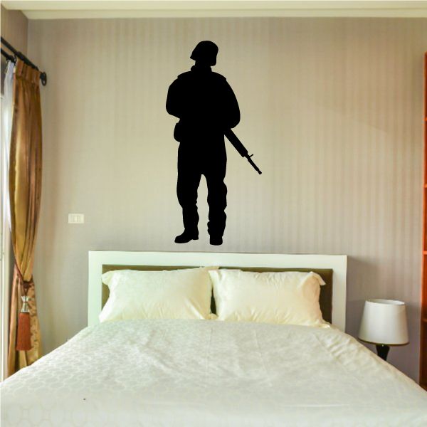 Helmeted soldier standing decal, black silhouette with rifle.