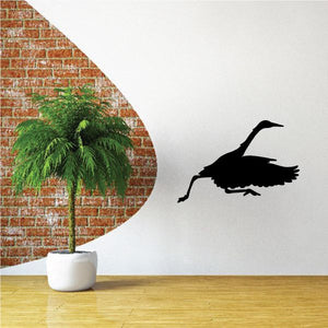 Heron wall decal: black bird silhouette on vinyl, for walls or cars.