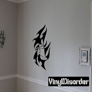 Black tribal dragon wall decal sticker with flame-like wing shapes
