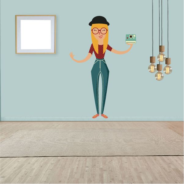Hipster taking photo sticker of cartoon woman in glasses holding a small camera