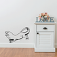 Hissing iguana wall decal with black outline, curved tail and raised head.