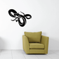 Turning hissing snake wall decal, black outlined design with stylized mouth