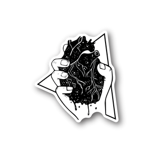 Vinyl sticker with graphic hands holding a heart, black and white outline