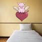 Pink pig with wings sticker holding a dark red heart, cartoon Valentine design
