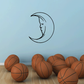 Hollow moon decal with crescent outline and profile face