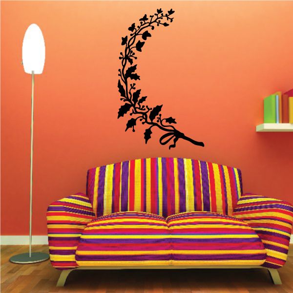 Holly vine wall decal with a black leafy branch and berries silhouette