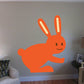 Orange hopping Easter bunny sticker with smiling face