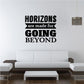 Wall decal with bold black and gray text: "HORIZONS are made for GOING BEYOND"